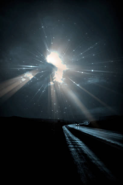 istock Single car travels on dark road 954554586