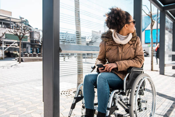 istock Disabled woman waiting at the bus station 954557864