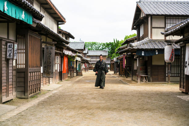 istock Samurai warrior with Sword on an old street in Japan 954559748