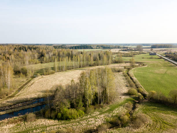 istock drone image. aerial view of rural area with fields and forests 954563596