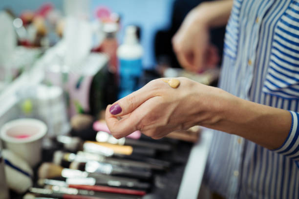 Close up hands of makeup artist
