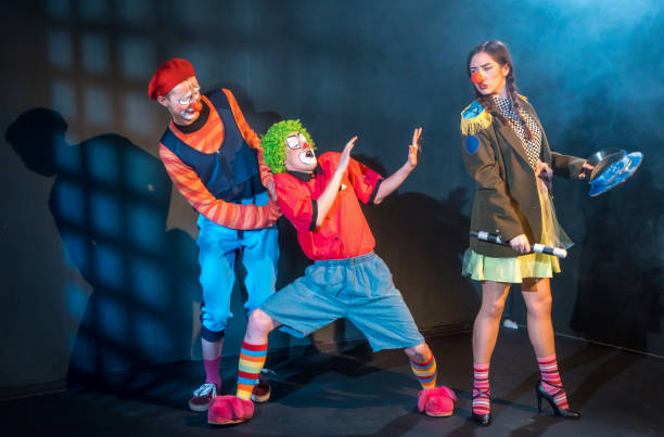 istock Clowns Playing Performance. Angry Policewoman Scaring Two Friends 954566508