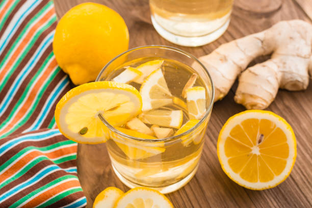istock Lemonade with lemon and ginger in a transparent glass 954568720