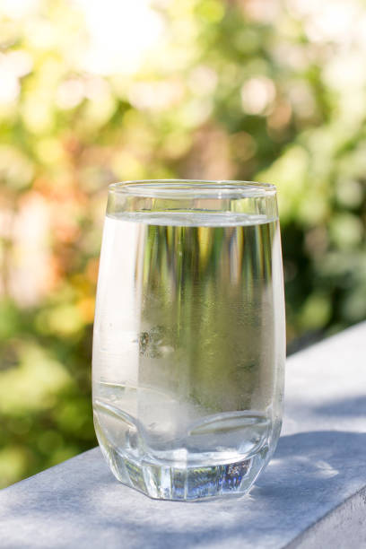 istock a glass of cold water on nature background for Refreshing 954569922