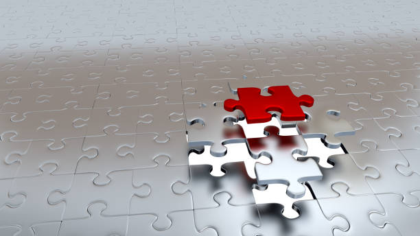 istock One Red Puzzle Piece escaping from Four other Silver Pieces 954570080