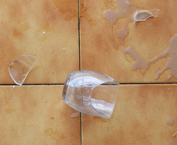 istock Broken Glass on Spanish Terracotta Floor 954570188