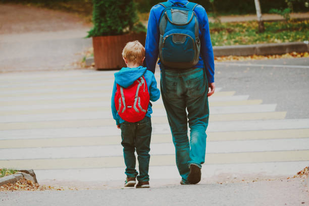 istock father and son go to school, education 954570212