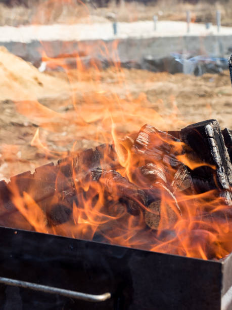 istock Fire from burning wood in the grill outdoors 954570814