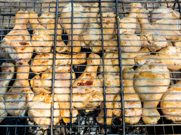 istock Fresh grilled chicken baked over coals in an open space 954570998