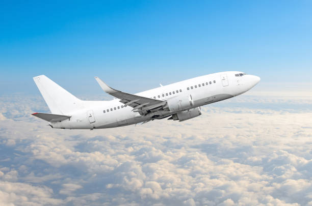 istock Passenger airplane fly on a hight above overcast clouds and blue sky. 954573554