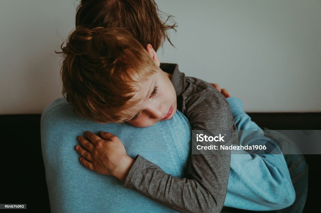 Father comforting sad child, parenting, sorrow Father comforting sad child, parenting, sorrow, stress Child Stock Photo