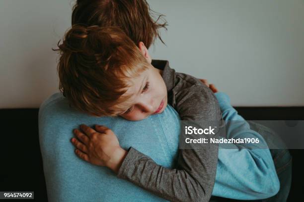 Father Comforting Sad Child Parenting Sorrow Stock Photo - Download Image Now - Child, Grief, Sadness