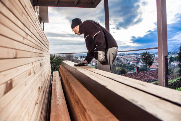 istock Man Painting  Wooden Plank 954574344
