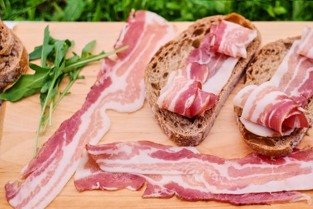 istock Bread with gourmet meat on a wooden desk. 954575104