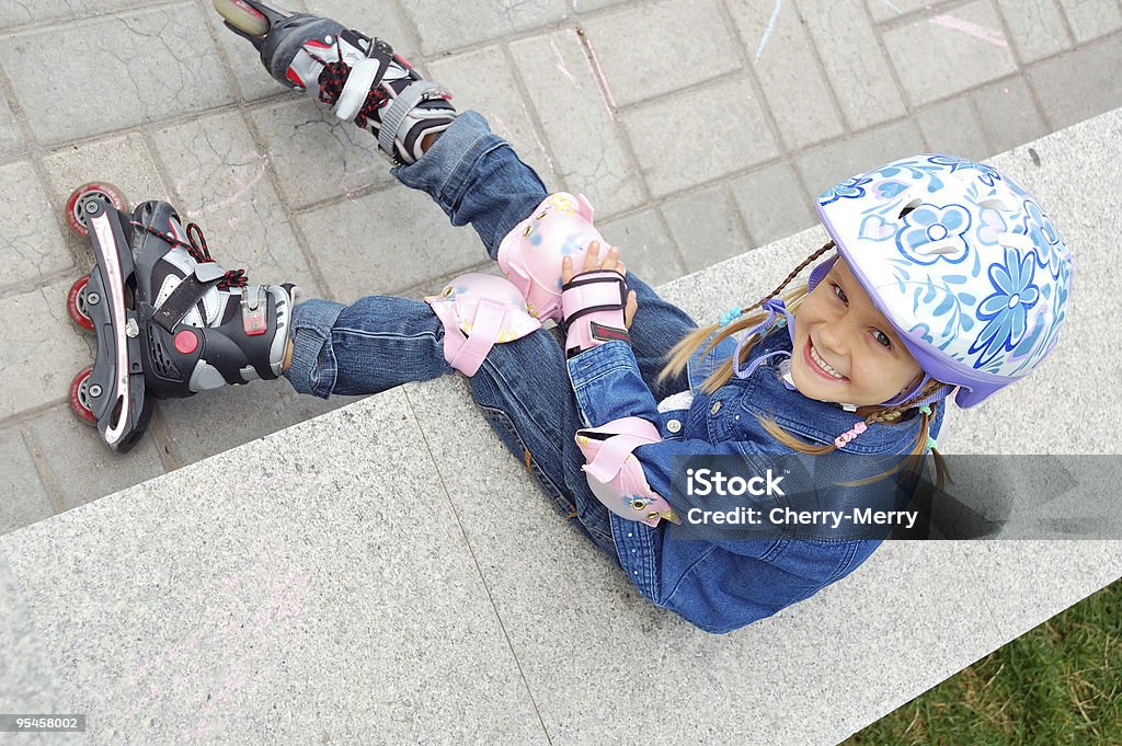 child with rollerskates and  helmet  4-5 Years Stock Photo