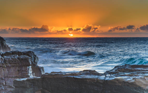 istock Rocky Sunrise Seascape 954588534