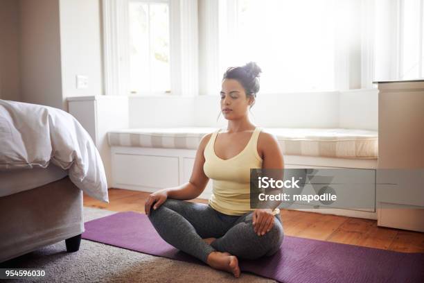 Beginning My Day With Meditation Stock Photo - Download Image Now - Meditating, Women, One Woman Only