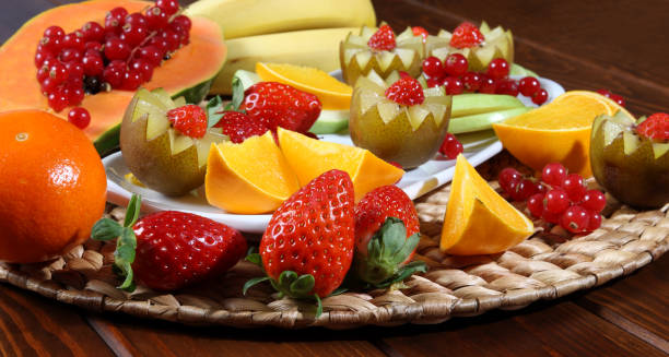 istock Kiwi surrounded by juicy fruits 954603472