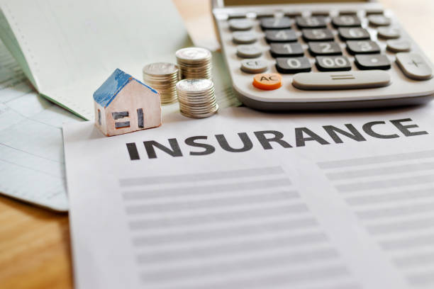 istock Home insurance form with money,passbook  and calculator. 954606436