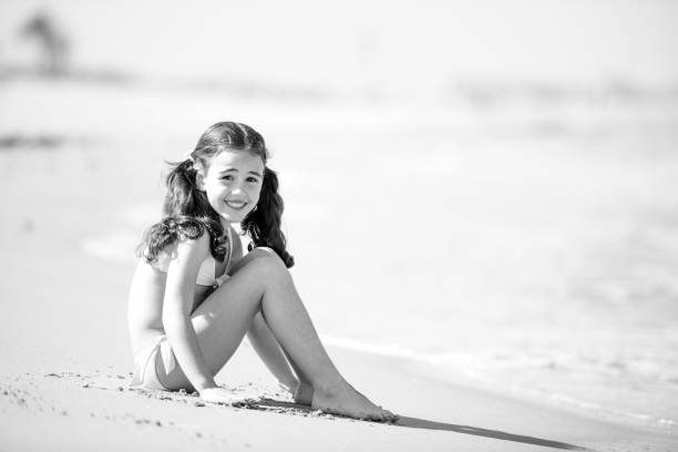 istock Little girl posing beach 954611742