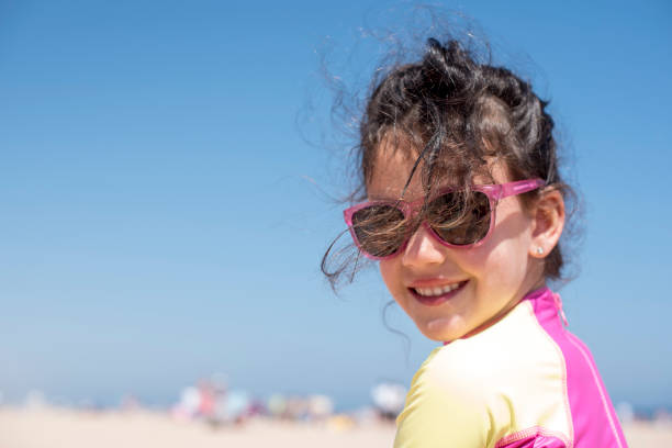 istock Little girl posing beach 954611940