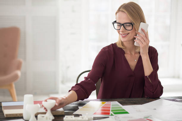 istock Thoughtful beautiful businesswoman ordering fabric 954616504