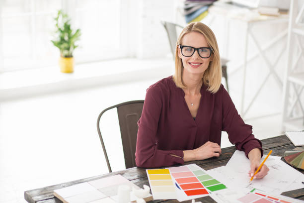 istock Successful female designer hesitating about color 954617034