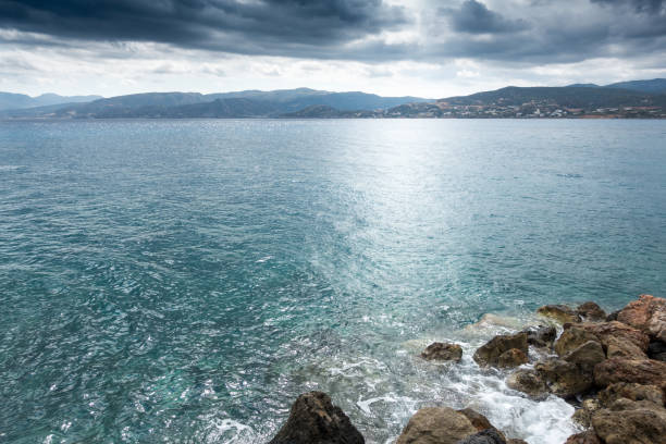 istock Seascape and mountain against sky 954617784