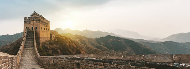 istock wide panoramic view on great wall at sunrise 954618212