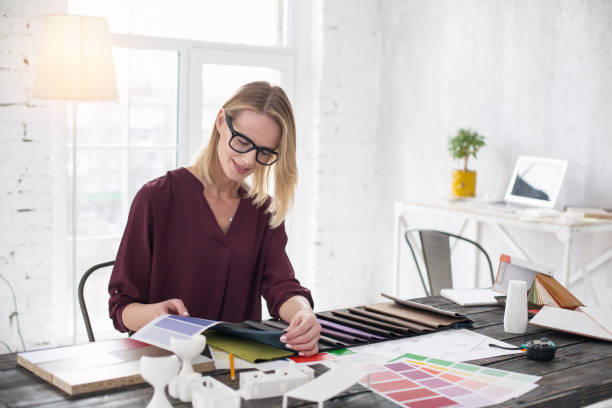 istock Pleased female designer combining color 954620352