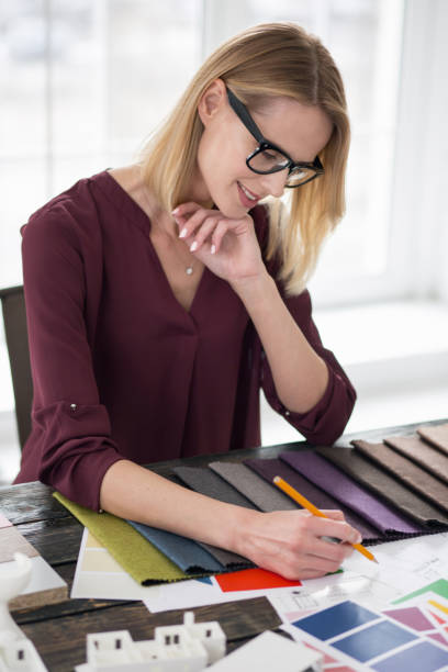 istock Pensive female designer searching material 954620886