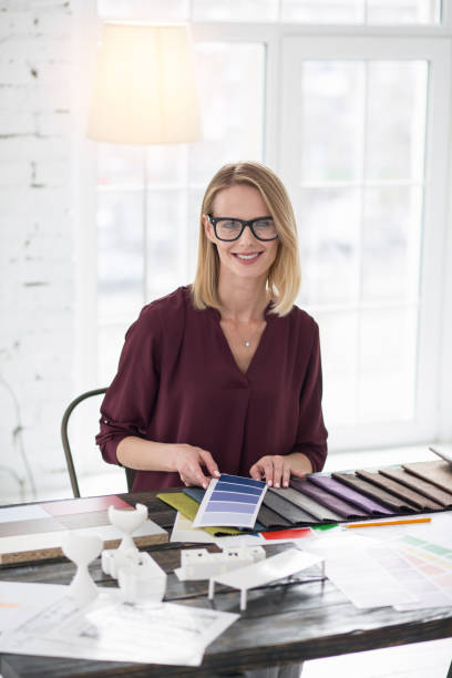 istock Pretty female designer comparing colors 954620998