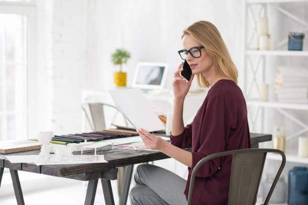 istock Attentive focused businesswoman calling client 954621208