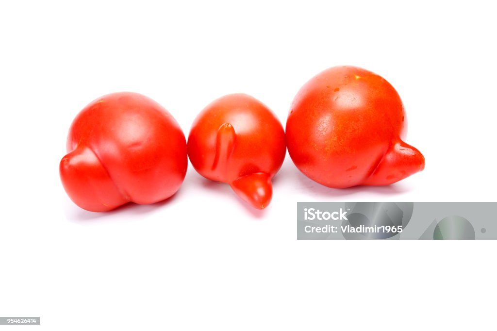 Three ugly tomatoes Three ugly tomatoes isolated on white background Bizarre Stock Photo