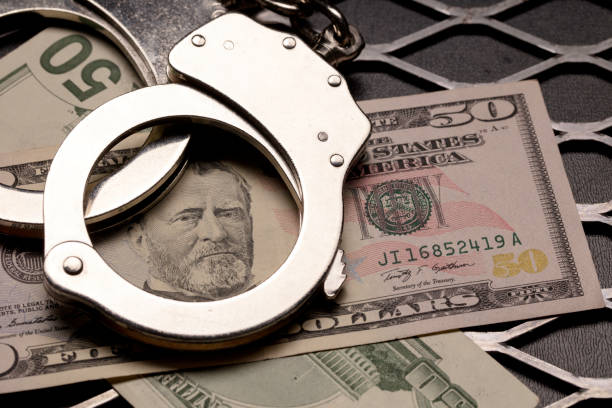 istock Handcuffs and Money 954634192