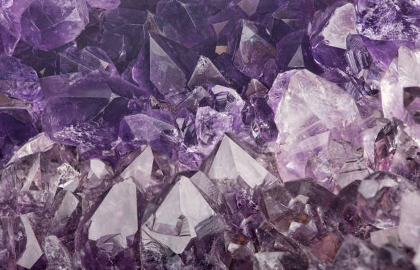 istock dark lilac amethyst crystals closeup backgrond 954634362