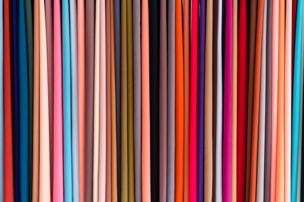 istock Different colour clothing making multi colour pattern in a clothing market in Malaysia. 954634402