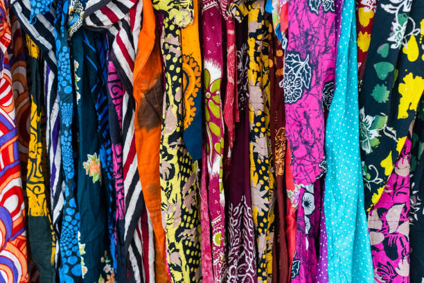 istock Different colour clothing making multi colour pattern in a clothing market in Malaysia. 954634442
