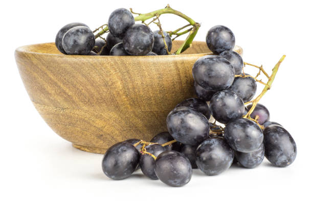 istock Fresh Black Wine Grapes isolated on white 954635728