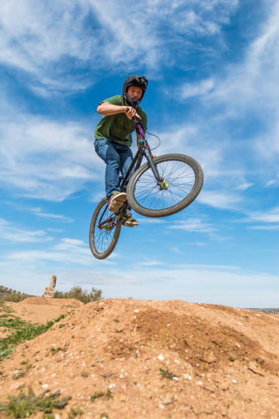 istock Young man flying on dirtjump bike 954637328