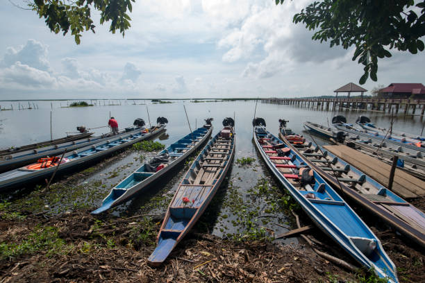 istock Fisherman boat waiting at the shore. 954639486