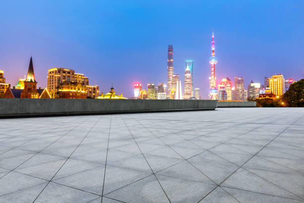 istock empty square floor and beautiful city skyline at night in shanghai 954642404