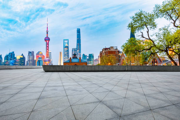 istock empty square floor and beautiful city skyline at night in shanghai 954643096