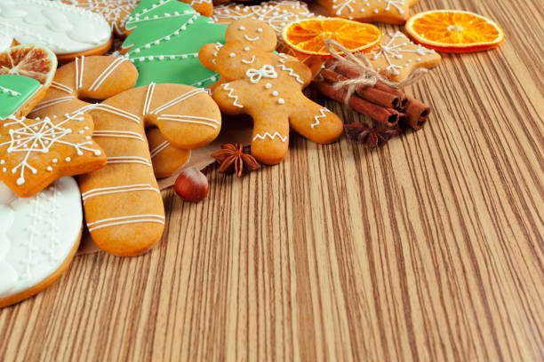 istock Christmas cookies on wood background 954645412