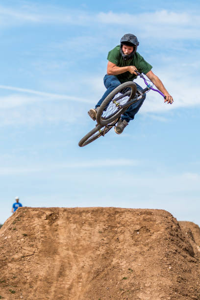 istock Young man flying on dirtjump bike 954645450