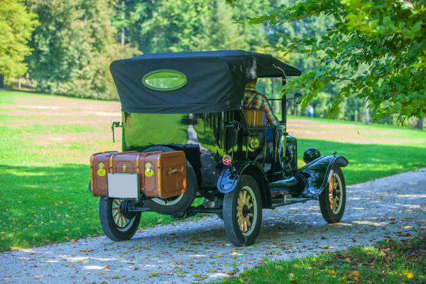 istock Vintage car and a nice green park in the back 954645500