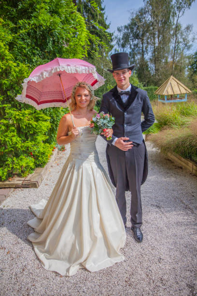 Madrid, spain may, 5 2018, White parasol and hand fan on garden grass