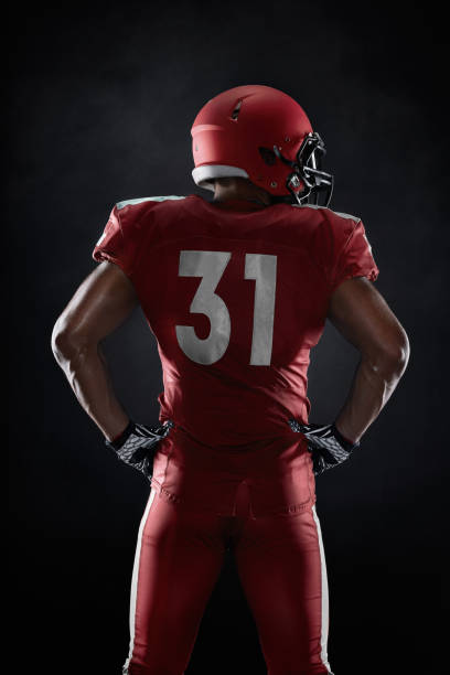 istock American football player on dark background 954649824