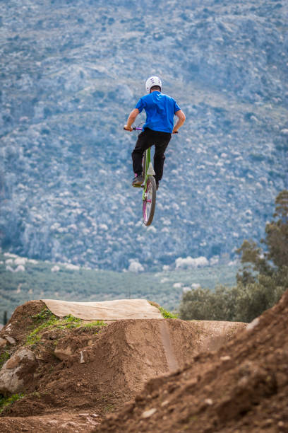 istock Young man flying on dirtjump bike 954651310