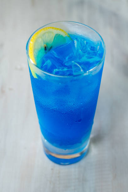 istock cocktail with Half lemon slice Tequila | Blue curacao | Lemon juice 954651996